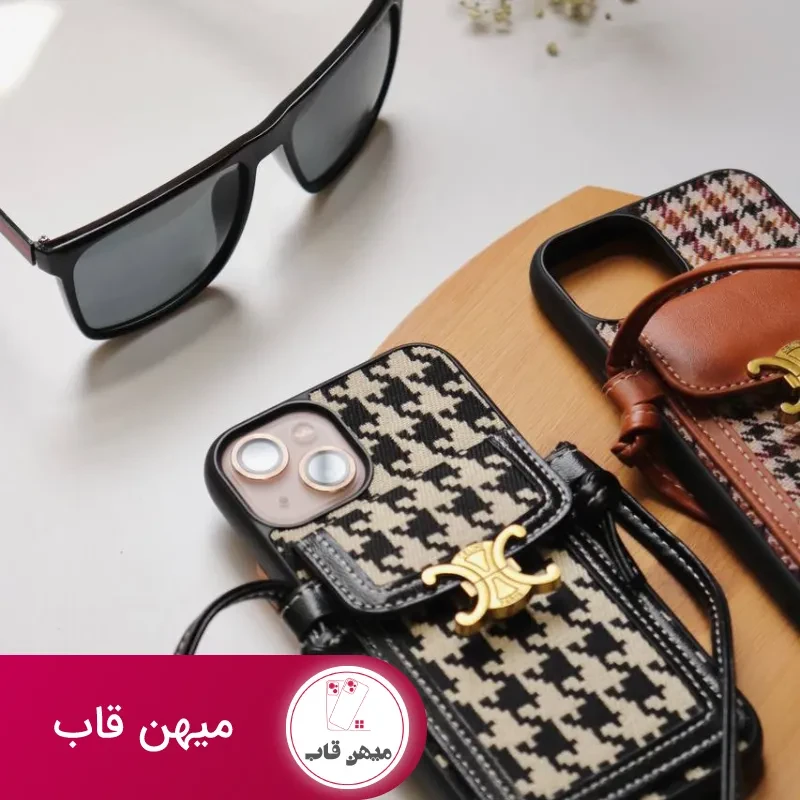 قاب موبایل آیفون پارچه ای و فلزی طرح باربری جاکارتی + بندست