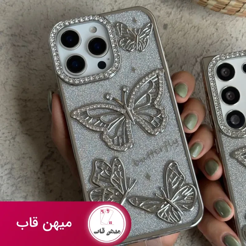 قاب موبایل آیفون – سامسونگ پروانه آموره نگین دار برجسته شاینی + بندست