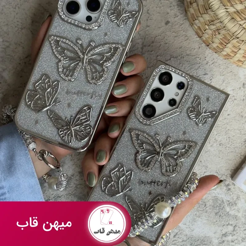 قاب موبایل آیفون – سامسونگ پروانه آموره نگین دار برجسته شاینی + بندست