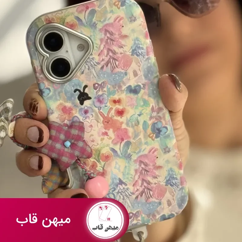 قاب موبایل آیفون خرگوش واندرلند + بندست گل پارچه ای