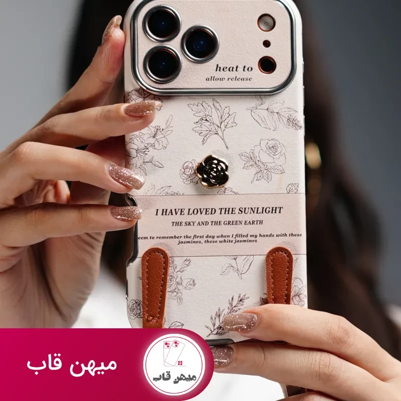 قاب موبایل آیفون گل طلایی انگلیسی الگانس محافظ لنزدار + بندست چرمی