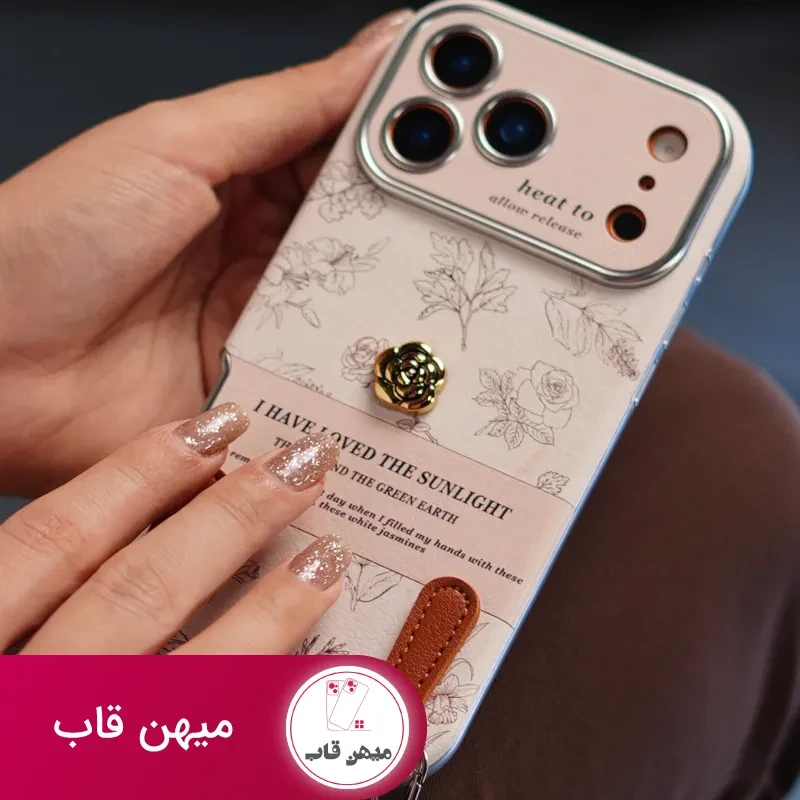 قاب موبایل آیفون گل طلایی انگلیسی الگانس محافظ لنزدار + بندست چرمی