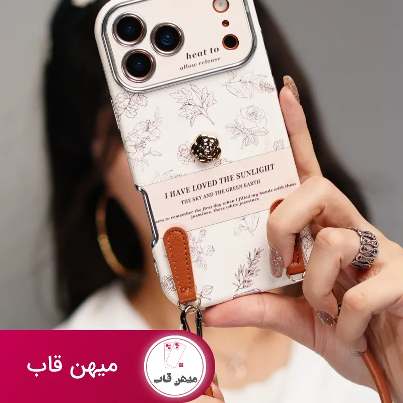 قاب موبایل آیفون گل طلایی انگلیسی الگانس محافظ لنزدار + بندست چرمی