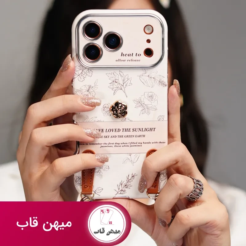 قاب موبایل آیفون گل طلایی انگلیسی الگانس محافظ لنزدار + بندست چرمی