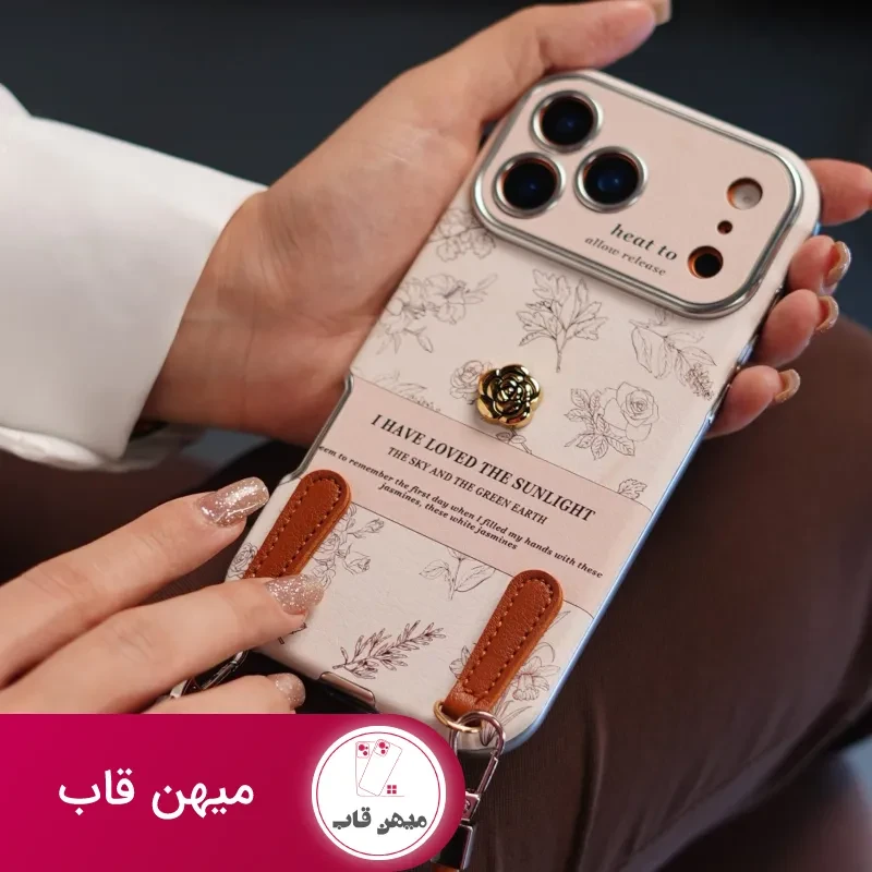 قاب موبایل آیفون گل طلایی انگلیسی الگانس محافظ لنزدار + بندست چرمی